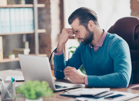 Frustrated Advisor at Desk Medium