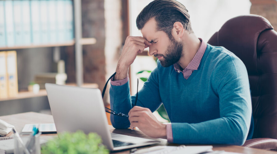 Frustrated Advisor at Desk Medium